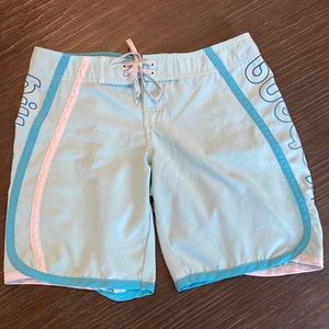 3/$15. Billabong swim shorts in light teal blue size one.